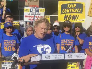 Photo of leader of nurse's strike in a Village Voice article about how direct voting for more progressive union leadership might lead to increased voting in national elections.