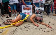 An activist protesting outside a carriage horse stable in 2025, during a rally supporting the passage of Ryder’s Law.